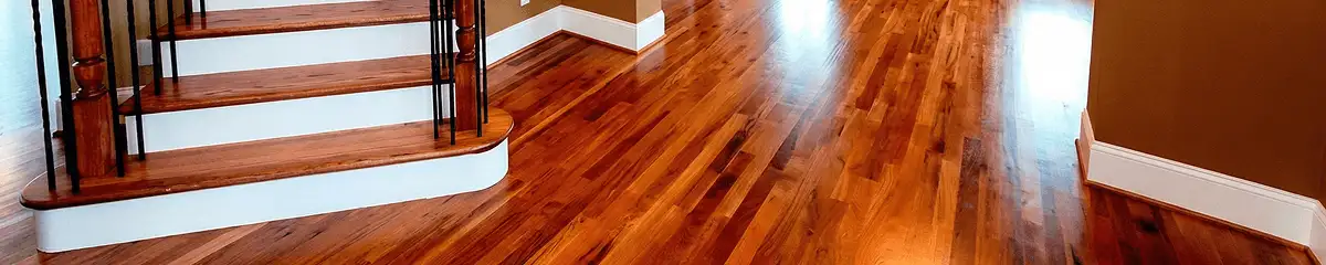 Base floor of a staircase with professionally restored wood flooring in Yonkers NY