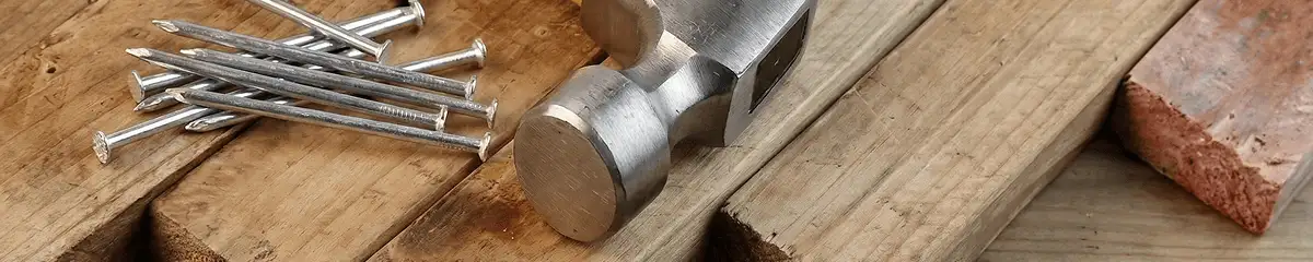 Hammer and nails on hardwood flooring boards in Yonkers, NY