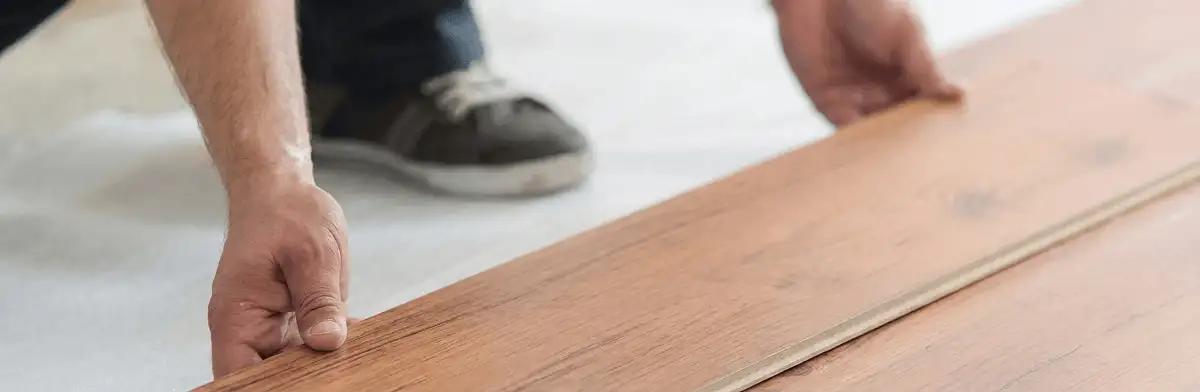 A professional installing laminate flooring in Yonkers, NY
