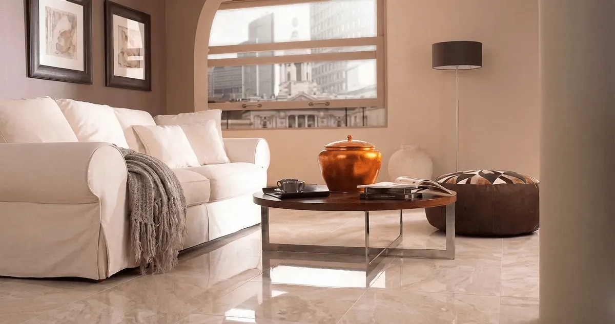 Modern living room with professionally installed marble flooring, a beige sofa, coffee table in Yonkers, NY